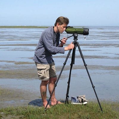 Photographer at sea shore in Canada